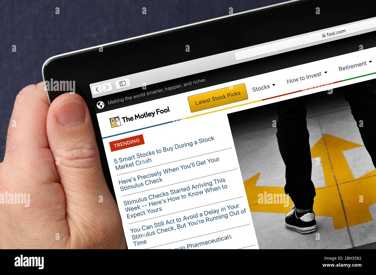 Website mit buntscheckigen Narren auf einem iPad (nur redaktionelle Verwendung) Stockfoto