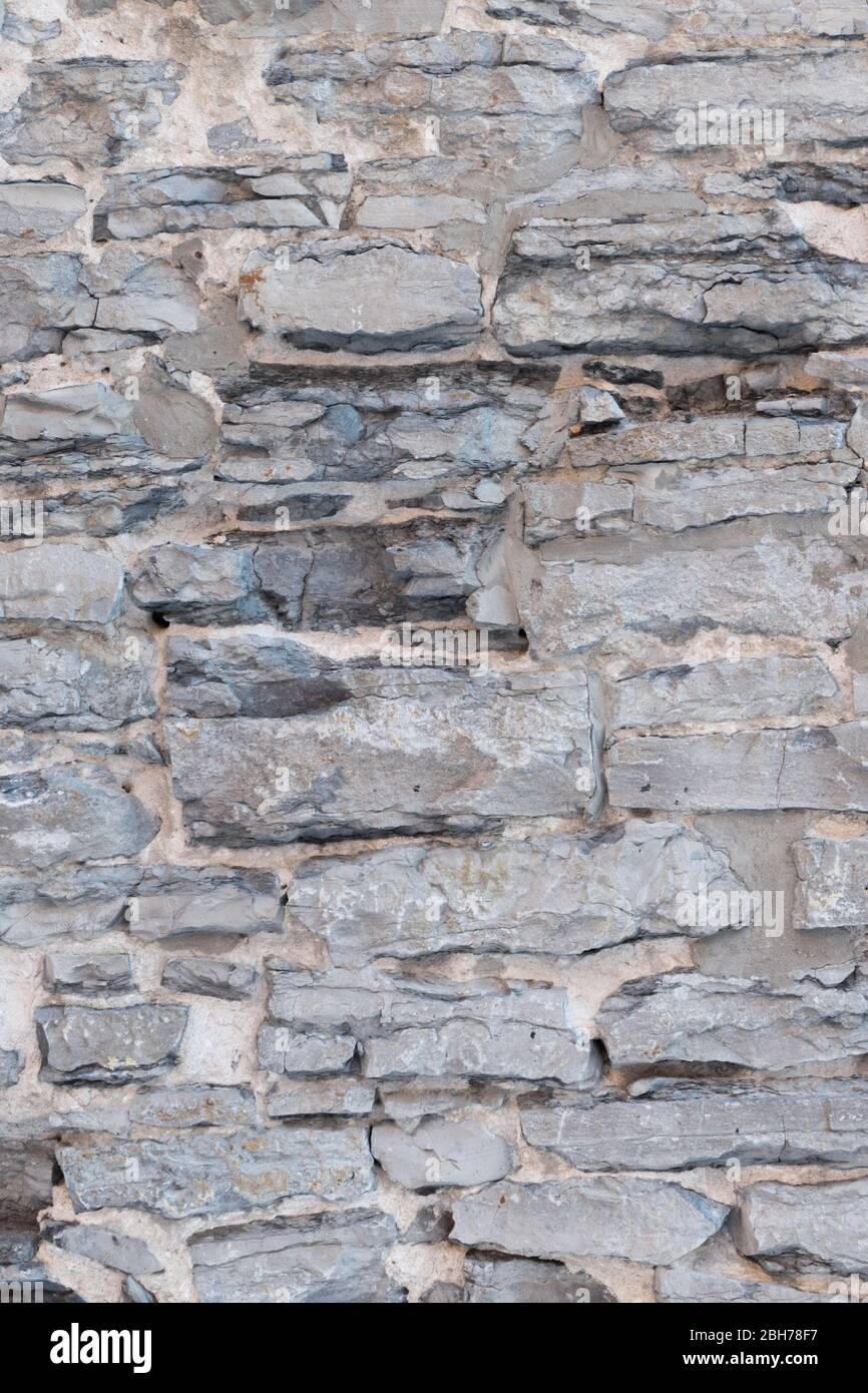 Strukturierte natürliche Tapete aus Limrestone Steinwand und Fugen Stockfoto