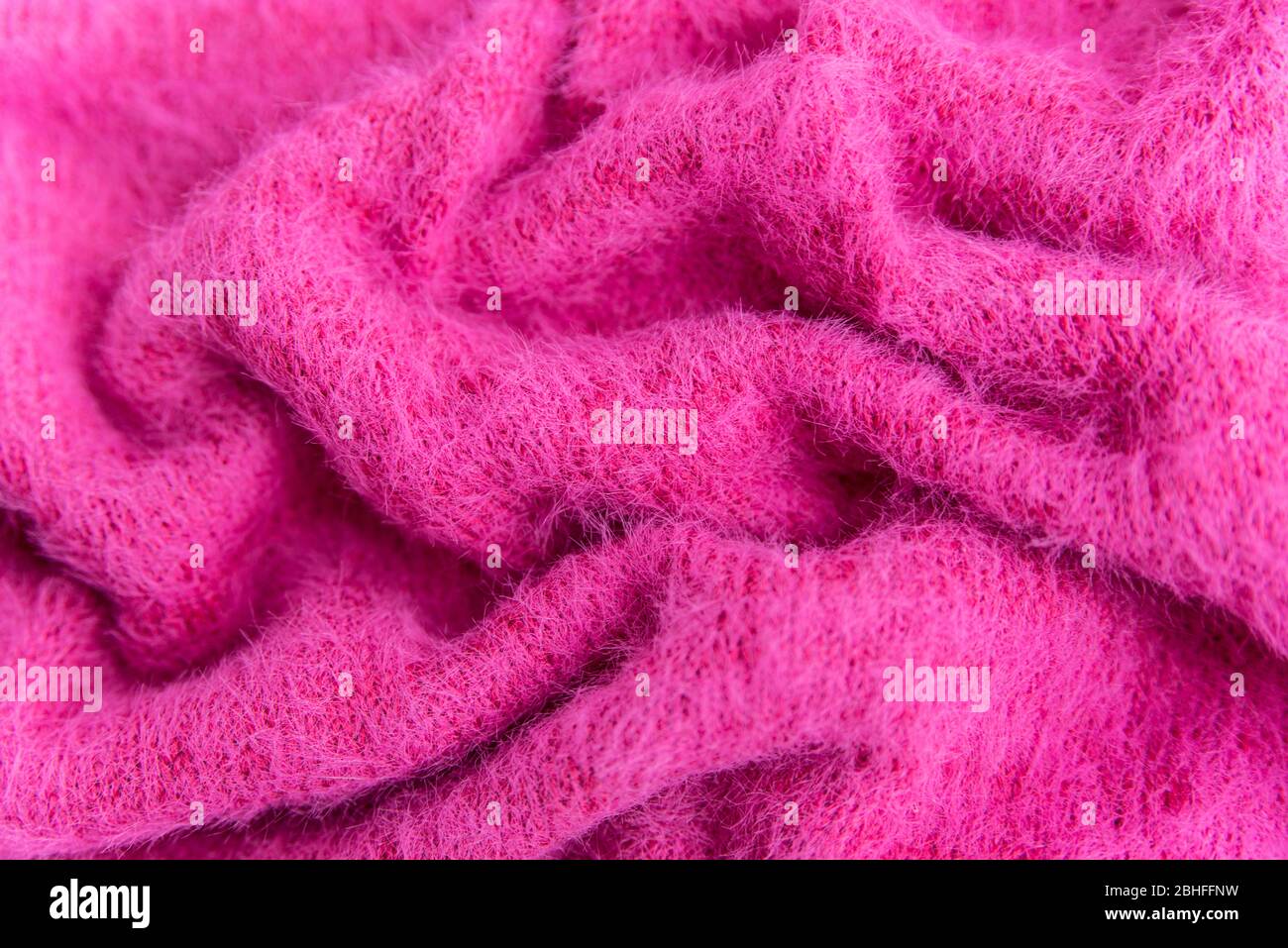 Wolltextur Hintergrund, gestrickte Wollstoff, rosa haarige flauschige Textil Stockfoto