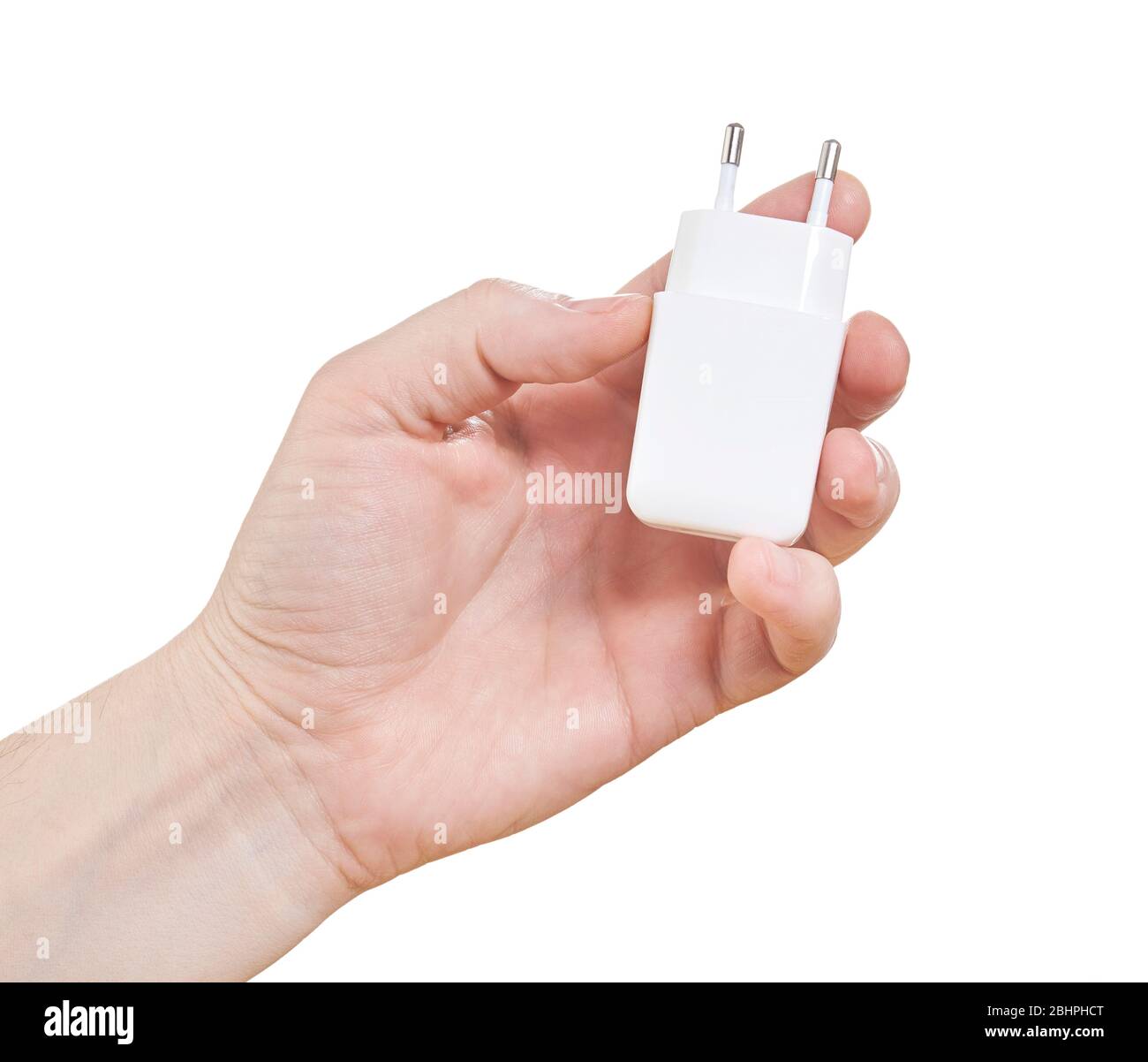 Weißes Ladegerät und Adapter für Handy oder Smartphone halten von Hand isoliert Stockfoto