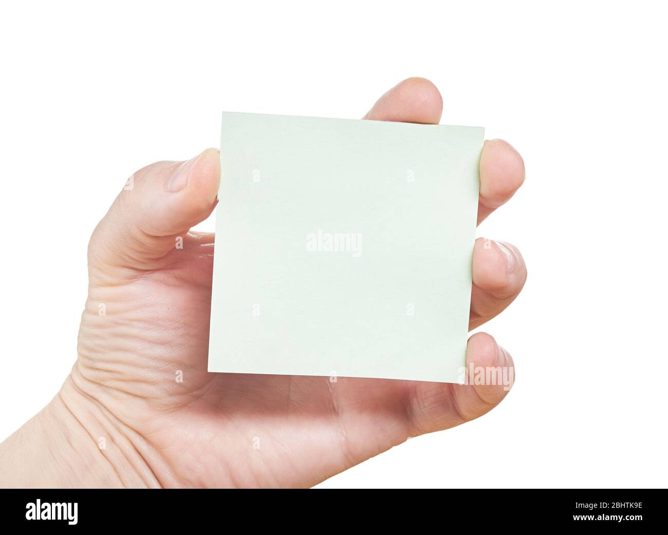 Hand hält eine Bürokarte isoliert auf weißem Hintergrund. Nahaufnahme Stockfoto