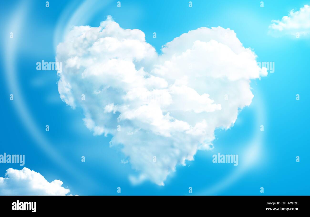 Herzförmige Wolken in einem blauen Himmel Stockfoto