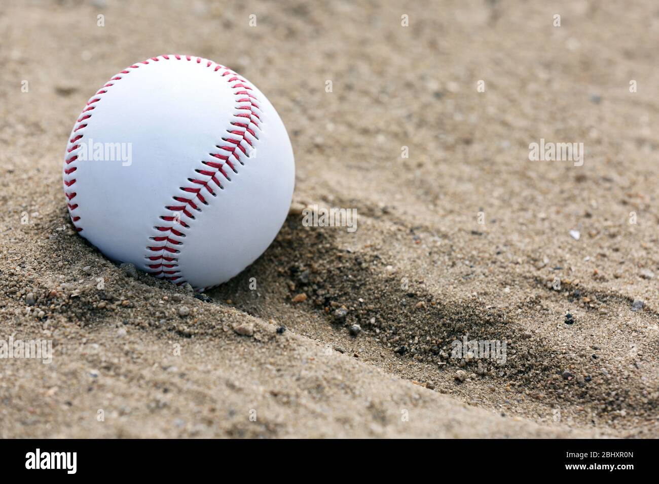 Baseball auf Sand Stockfoto