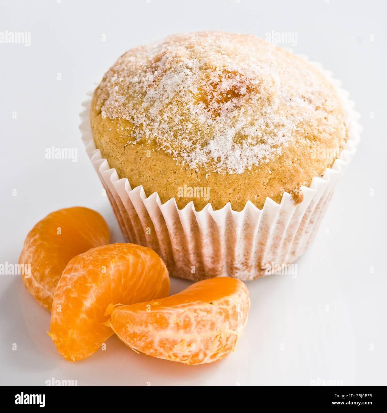 Mandarine Muffin mit Gießzucker gesprungenes - Stockfoto