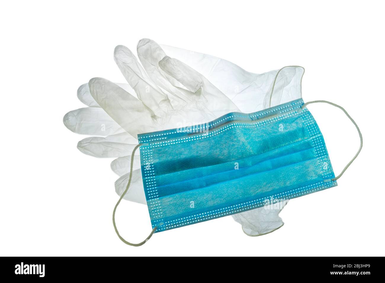 Transparente Einweg-Kunststoffhandschuhe und Gesichtsmaske/Gesichtsmaske zur Verhinderung der Ausbreitung von Keimen während der COVID-19 / Coronavirus / Corona-Virus-Pandemie Stockfoto