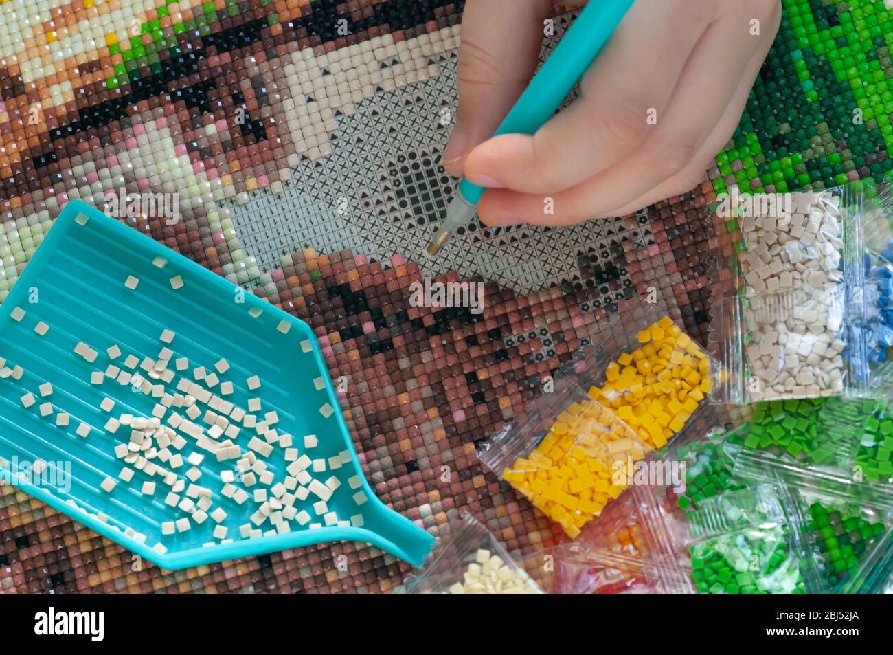 Sammeln Diamant-Stickerei, Diamant-Mosaik. Farbige Kristalle. Stockfoto