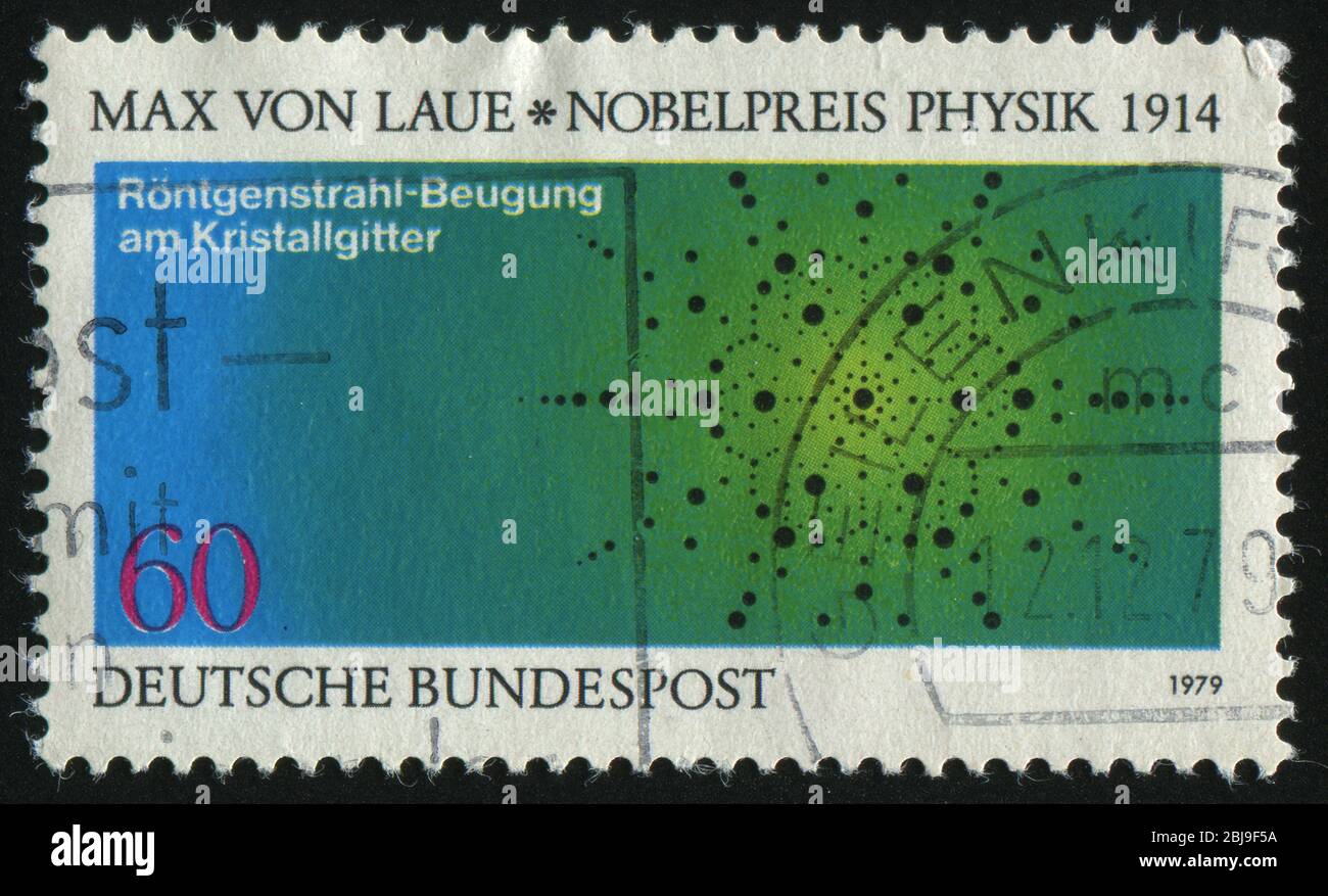 DEUTSCHLAND- UM 1979: Briefmarke gedruckt von Deutschland, zeigt Diagramm von Einsteins photoelektrischem Effekt, um 1979. Stockfoto