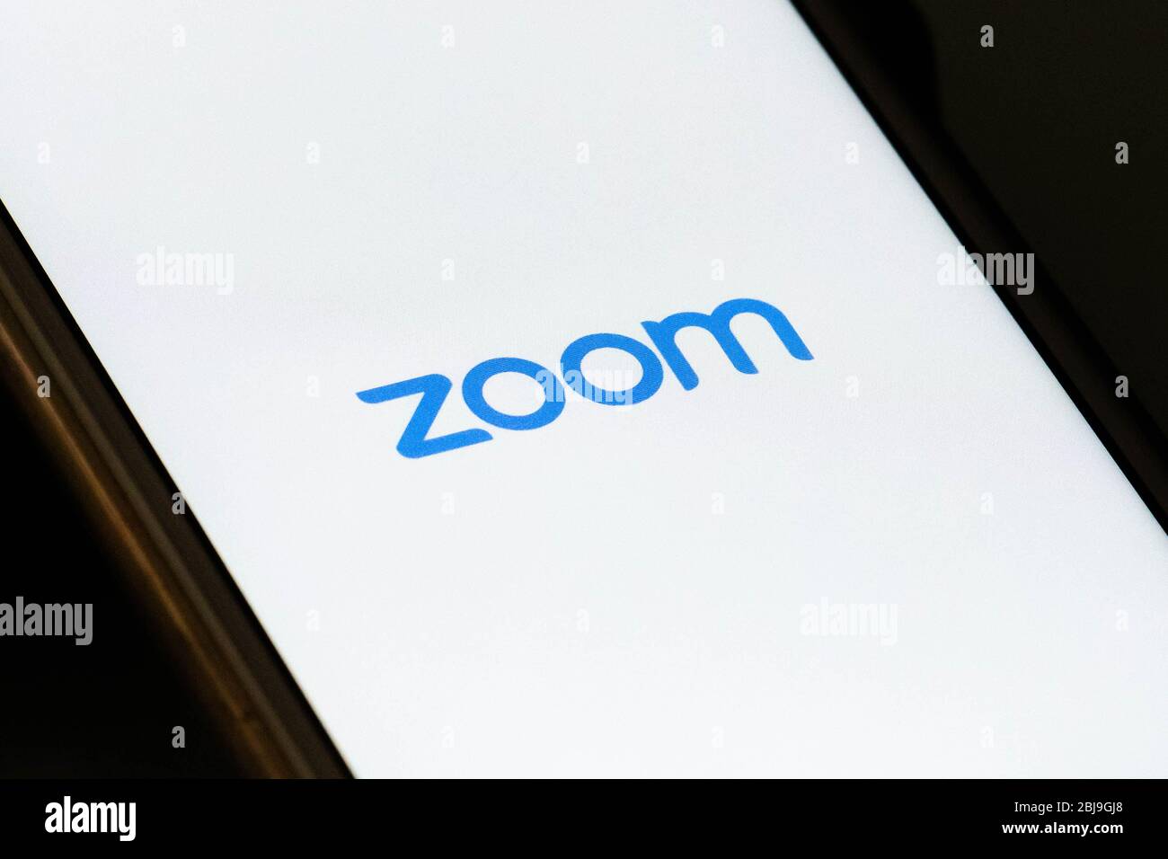 Zoom Video Communications App auf dem Smartphone, Videotelefonie, Videokonferenzen und Online-Chat-Dienste für Meetings und Arbeiten von zu Hause aus Stockfoto