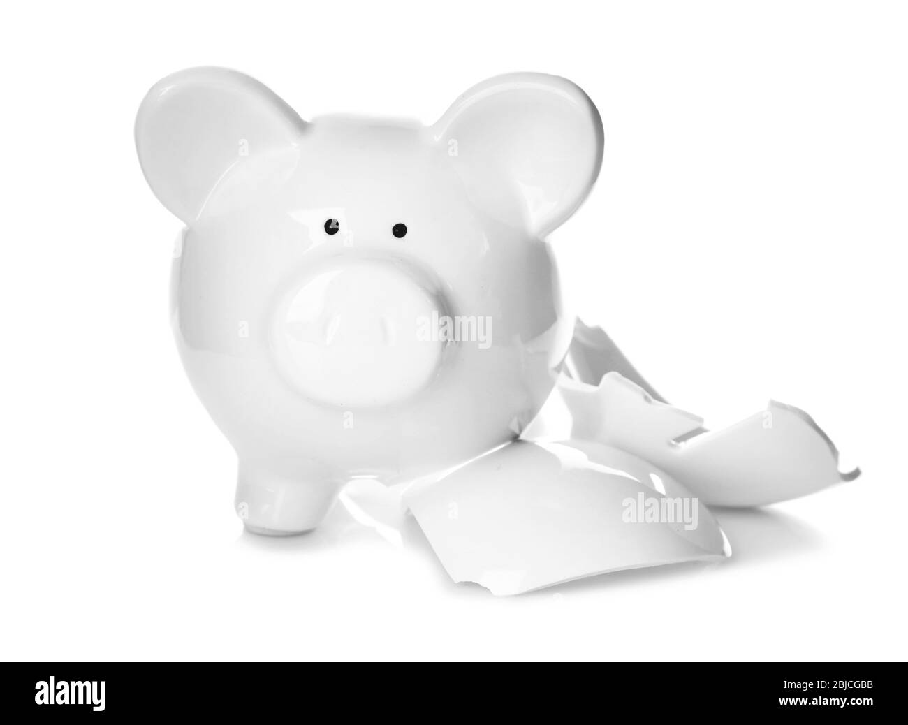 Gebrochene Sparschwein auf weißem Hintergrund Stockfoto