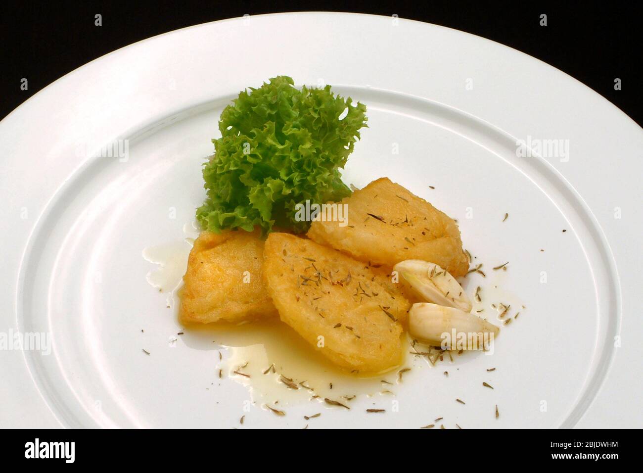 Italienische Gerichte Rezepte, gebackener Caciocavallo Käse mit Öl und Knoblauch gebraten Stockfoto