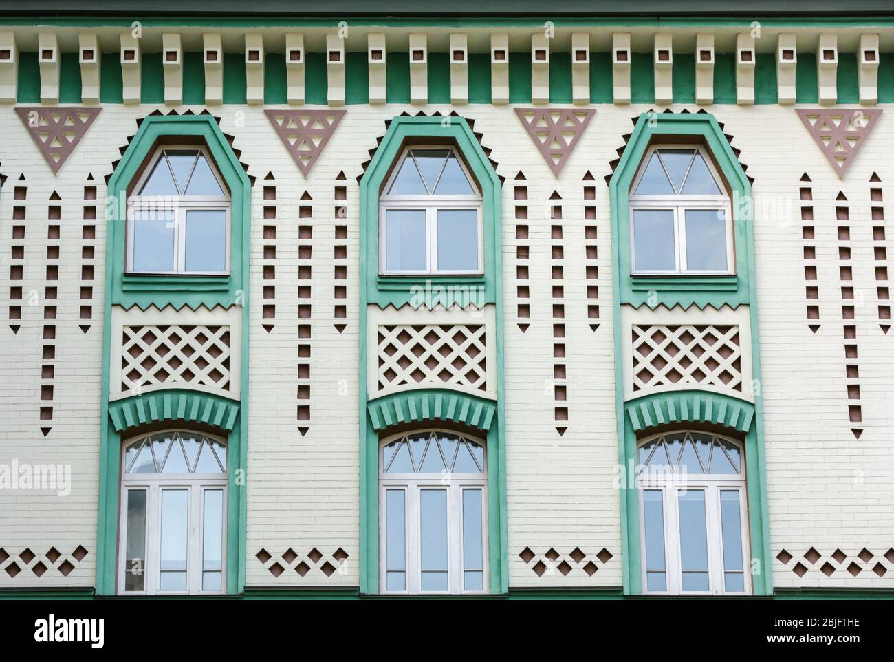 Bogenfenster mit Backstein-Wand Hintergrund Stockfoto