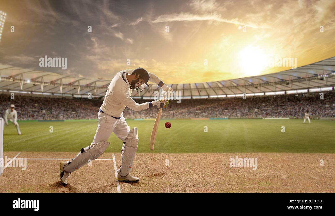 Batsman verteidigt einen Ball während eines Spiels im Stadion Stockfoto