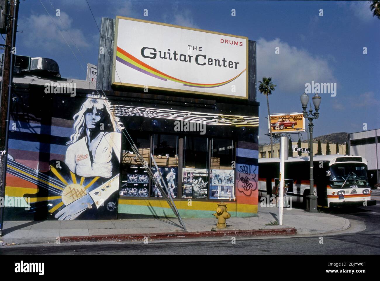 Die ursprüngliche Lage des Guitar Center mit Wandbild auf Sunset Blvd. At Vista in Hollywood, CA um 1980. Stockfoto