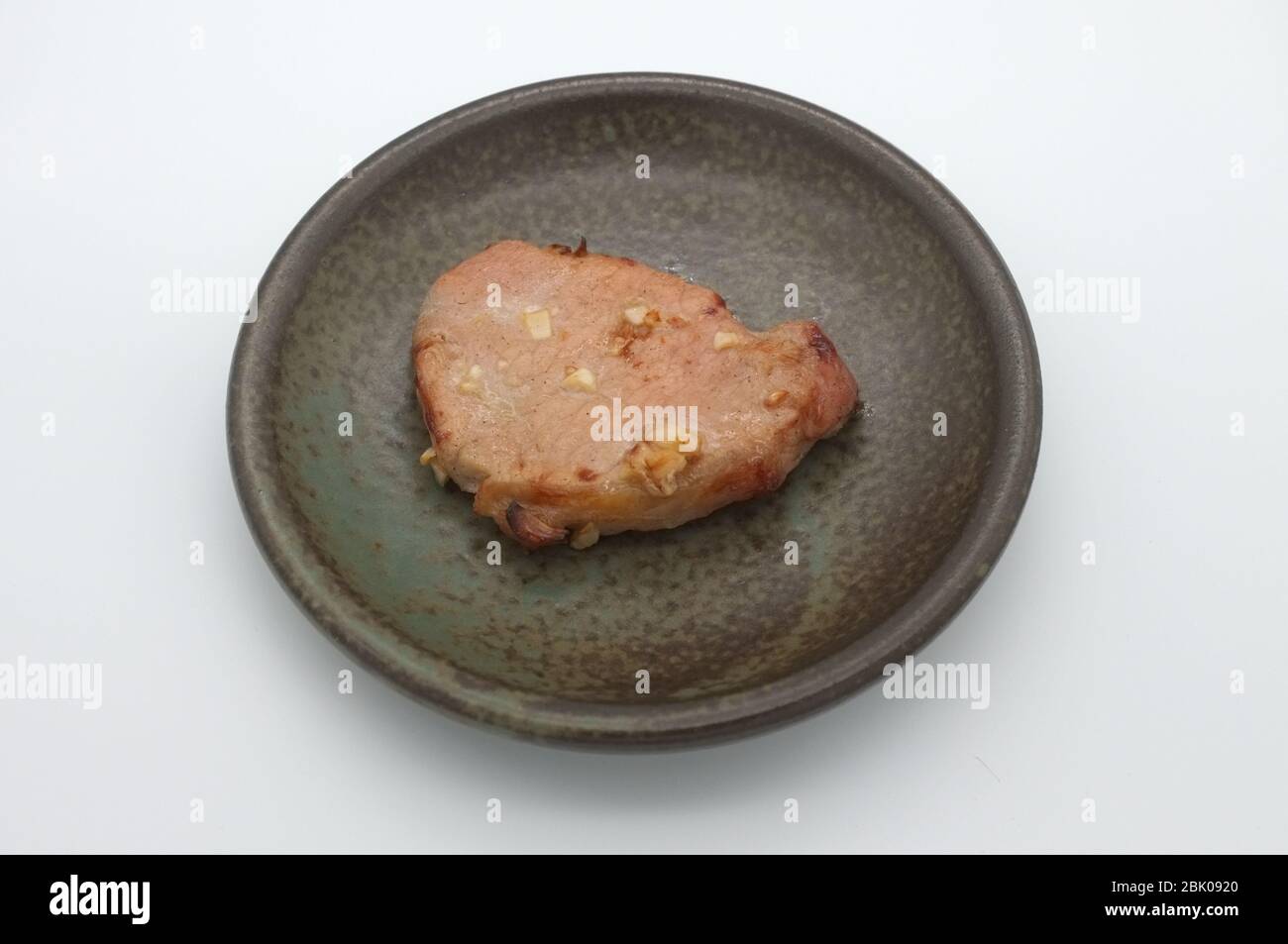 Tiefe gebratenes Schweinefleisch mit Knoblauch und Salz Stockfoto