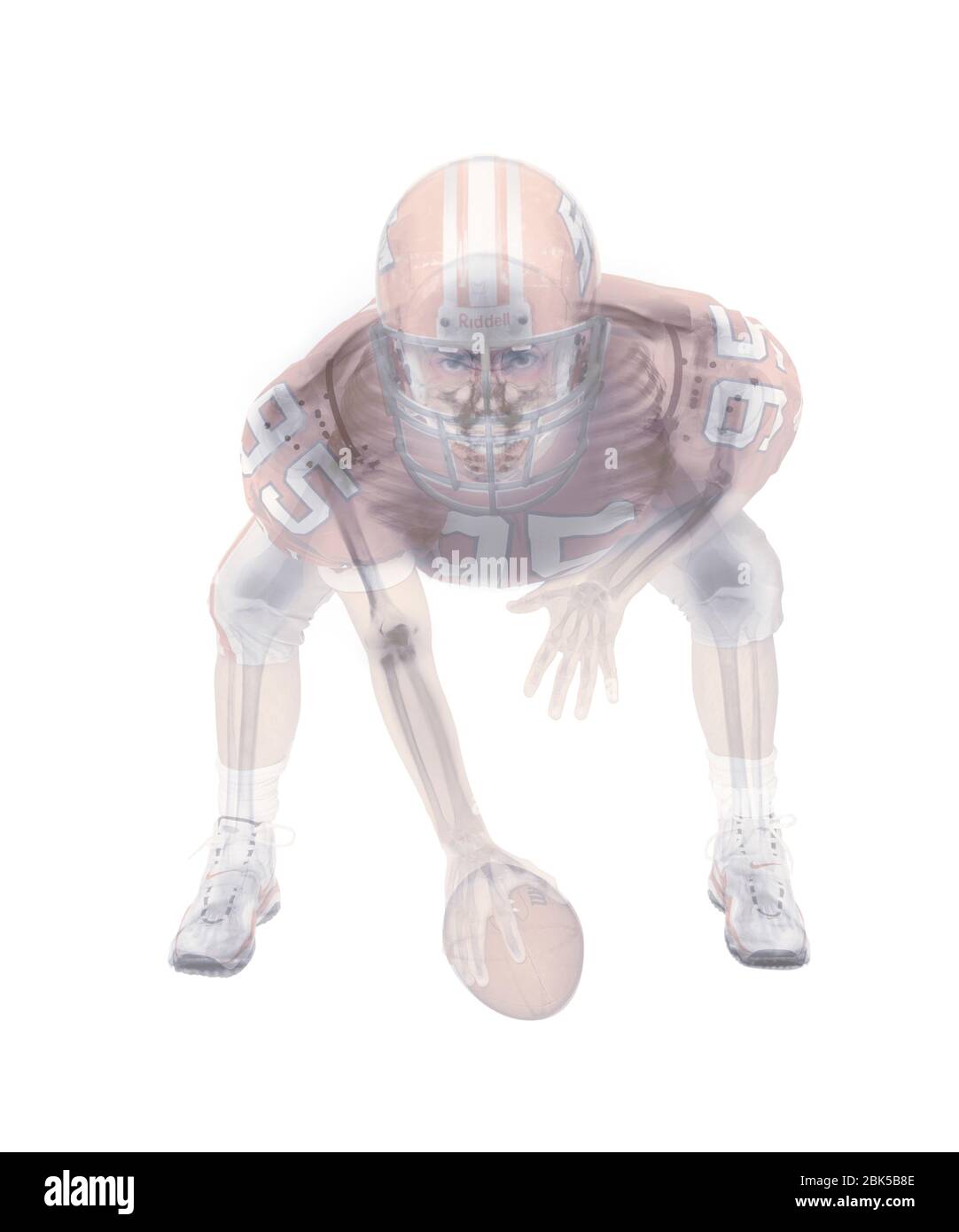 American Football Spieler Skelett, farbige Röntgenstrahlung. Stockfoto