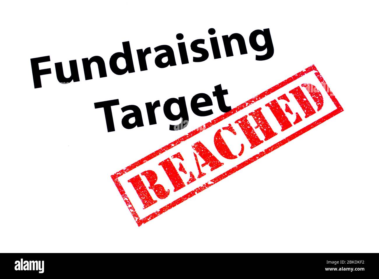 Fundraising Zielüberschrift mit einem roten ERREICHTEN Stempel. Stockfoto