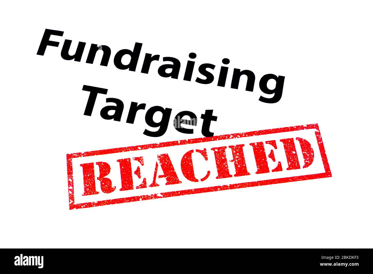 Fundraising Zielüberschrift mit einem roten ERREICHTEN Stempel. Stockfoto