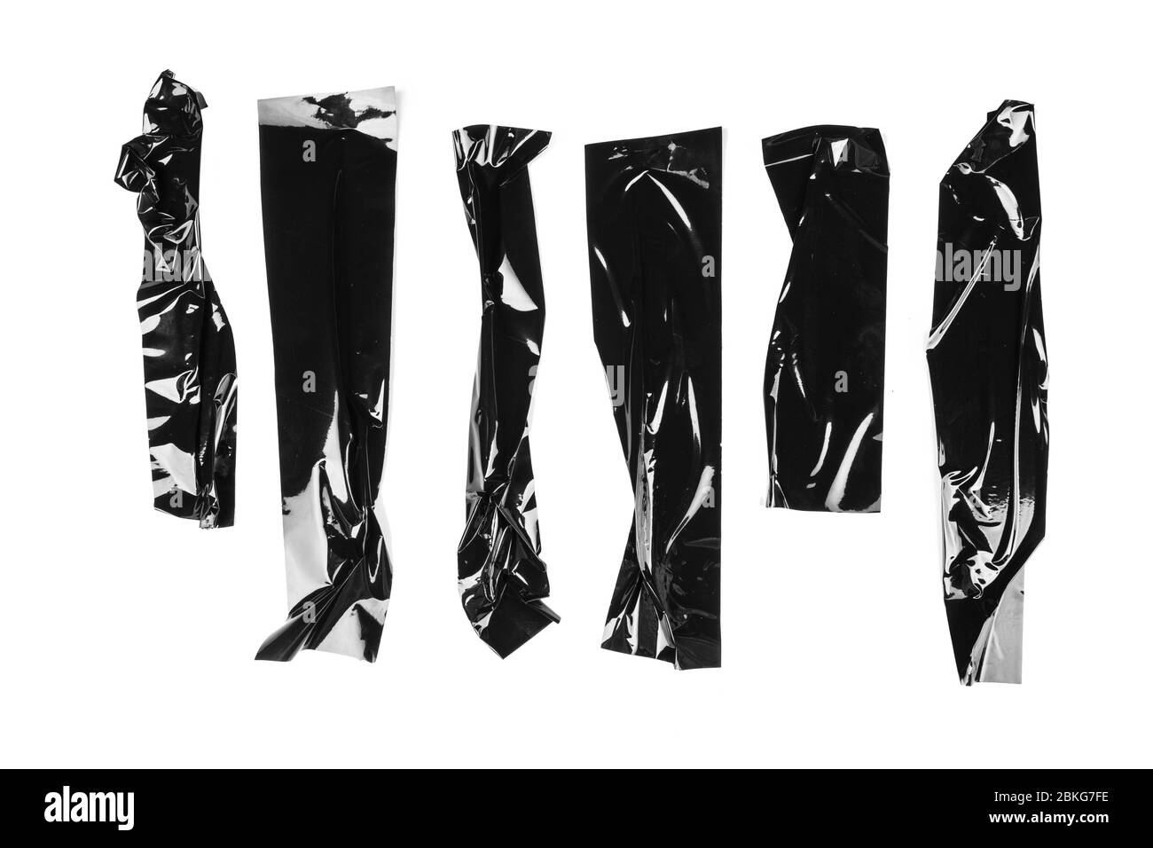 Zerrissene verschiedene Größe schwarzes Klebeband, Klebestücke Stockfoto