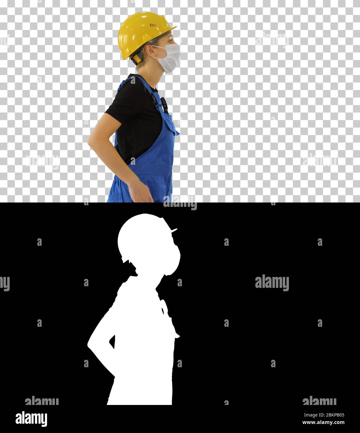 Bauarbeiterin in Overalls und in medizinischer Maske Walking, Alpha Channel Stockfoto
