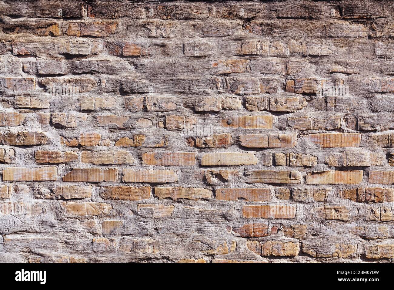 Rustikale Mauer Hintergrund an einem sonnigen Tag und grelles Licht Schatten Stockfoto