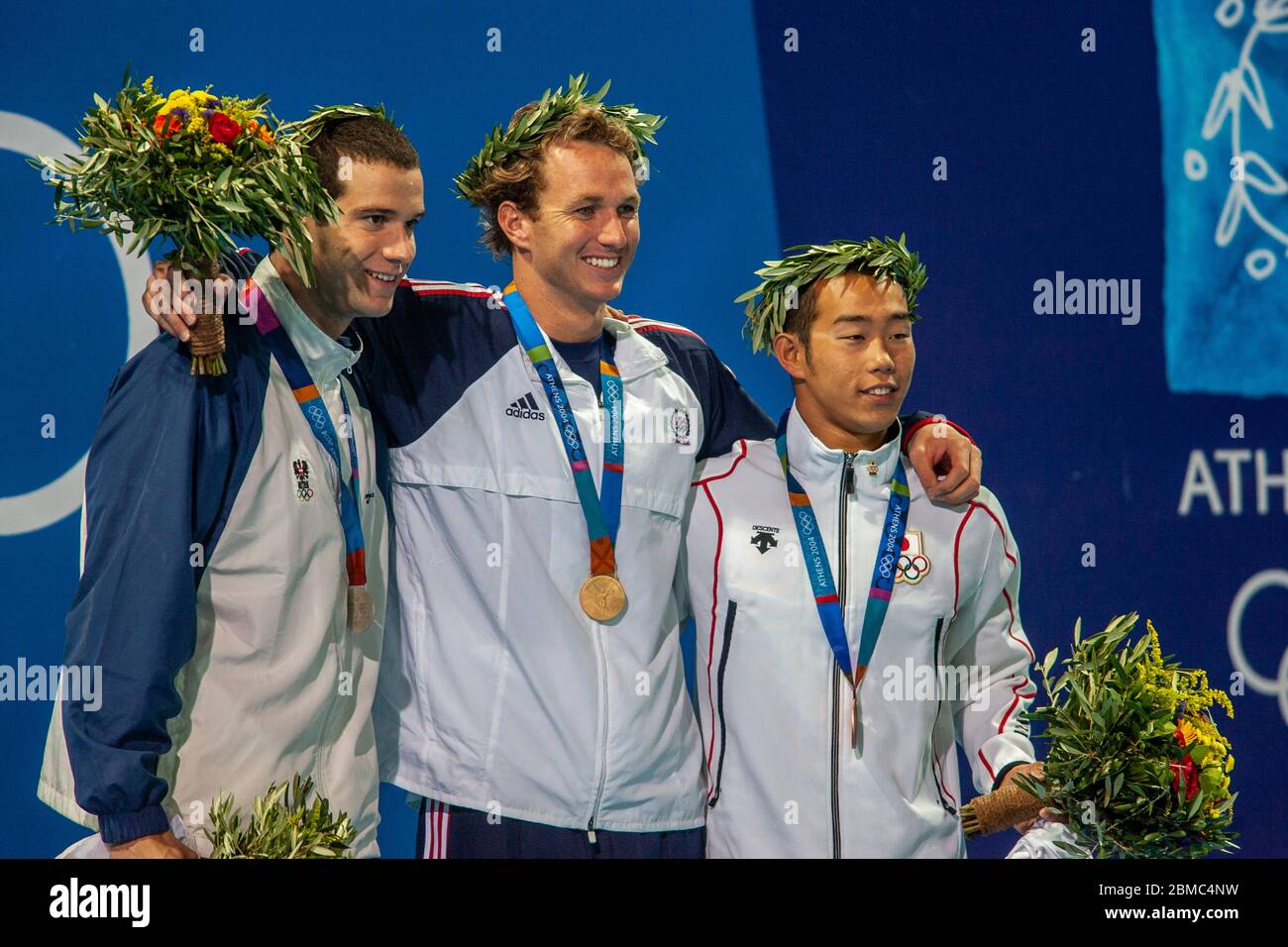 Aaron Peirsol (USA)-C- gewinnt die Goldmedaille, -L-Markus Roganin (AUT) Silber und Tomomi Morita (JPN) im 100 Meter Rückschlag Finale der Männer bei den 20 Stockfoto