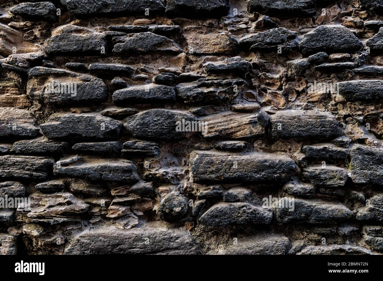 Alte feste Steinmauer. Hintergrund Texturbild. Stockfoto