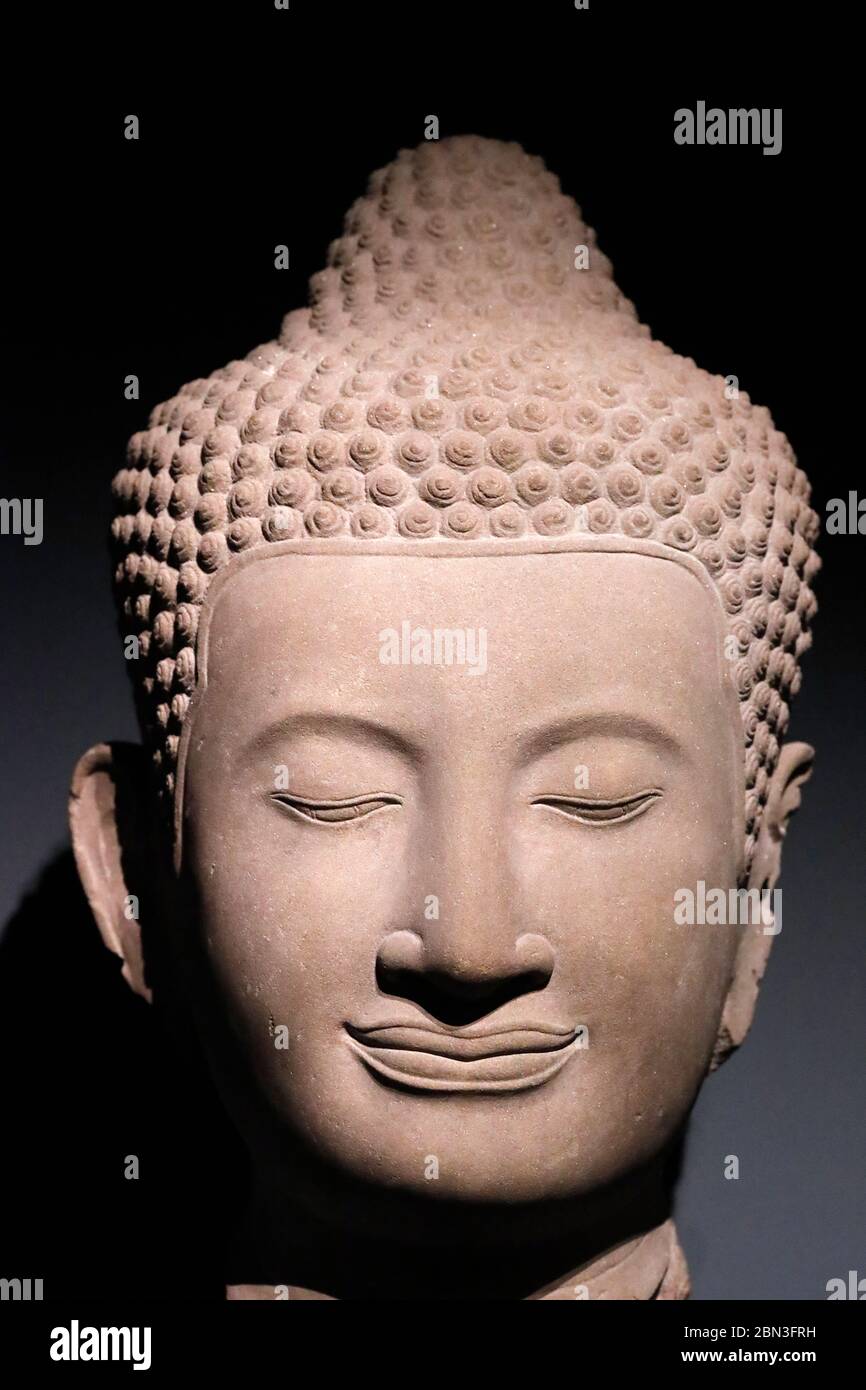Das Guimet National Museum of Asian Arts. Kopf des Buddha. Sandstein. 14. Jahrhundert. Bayon, Kambodscha. Paris. Frankreich. Stockfoto