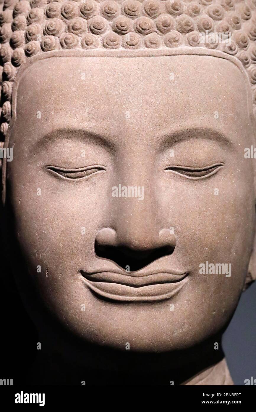 Das Guimet National Museum of Asian Arts. Kopf des Buddha. Sandstein. 14. Jahrhundert. Bayon, Kambodscha. Paris. Frankreich. Stockfoto