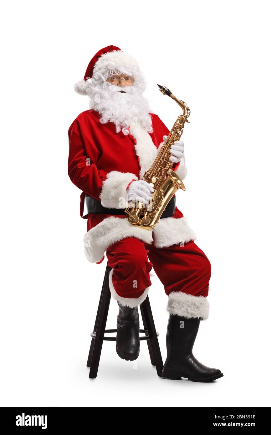Weihnachtsmann spielt den Saxophon isoliert auf weißem Hintergrund Stockfoto
