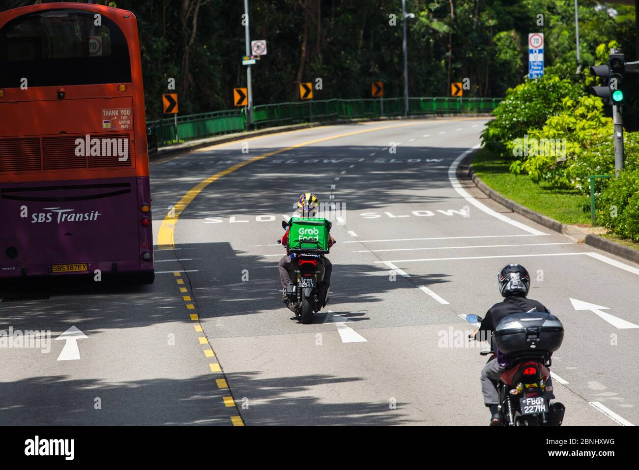 Fahrservice für Essenslieferungen unterwegs, Singapur Stockfoto