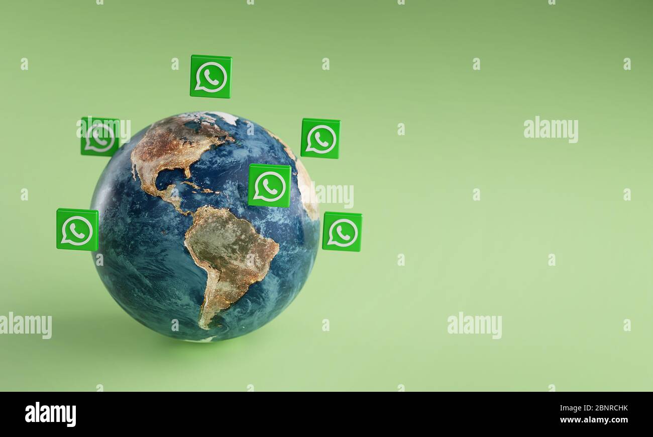 WhatsApp Logo Symbol um die Erde. Beliebtes App-Konzept. Stockfoto