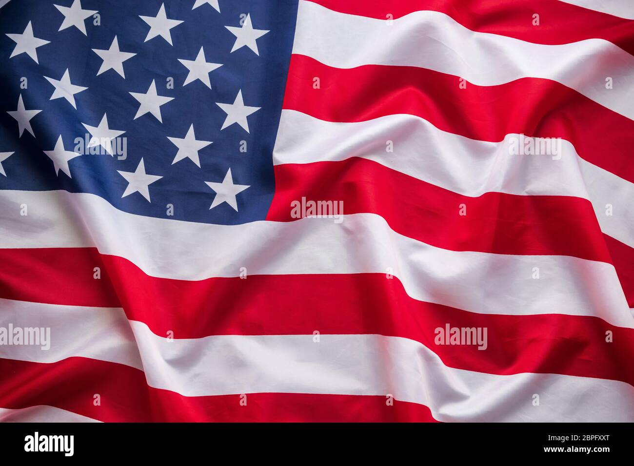 Amerikanische Flagge winken. Flagge von amerika national auf Leinwand Textur Hintergrund Banner für Unabhängigkeit Tag oder Feiertag Feier Stockfoto