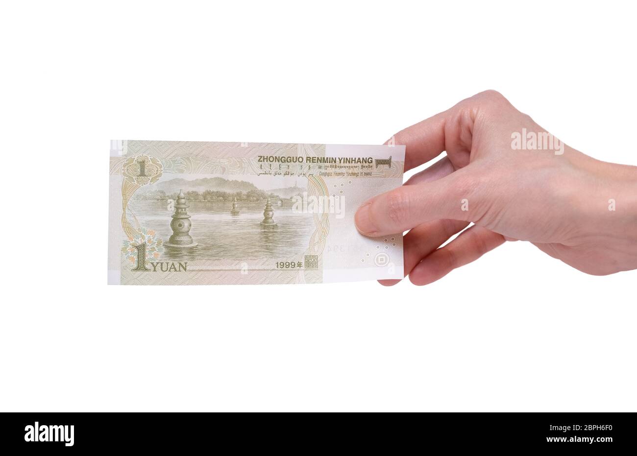 Weibliche Hand mit einer chinesischen Yuan-Banknote auf weißem Hintergrund isoliert. Stückelung von 1 Yuan. Stockfoto