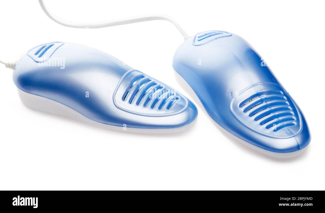 Elektroschuhe Trockner mit UV-Sterilisation auf weißem Hintergrund, Deodorant und antimykotische Wirkung. Konzept der gesunden Füße Stockfoto