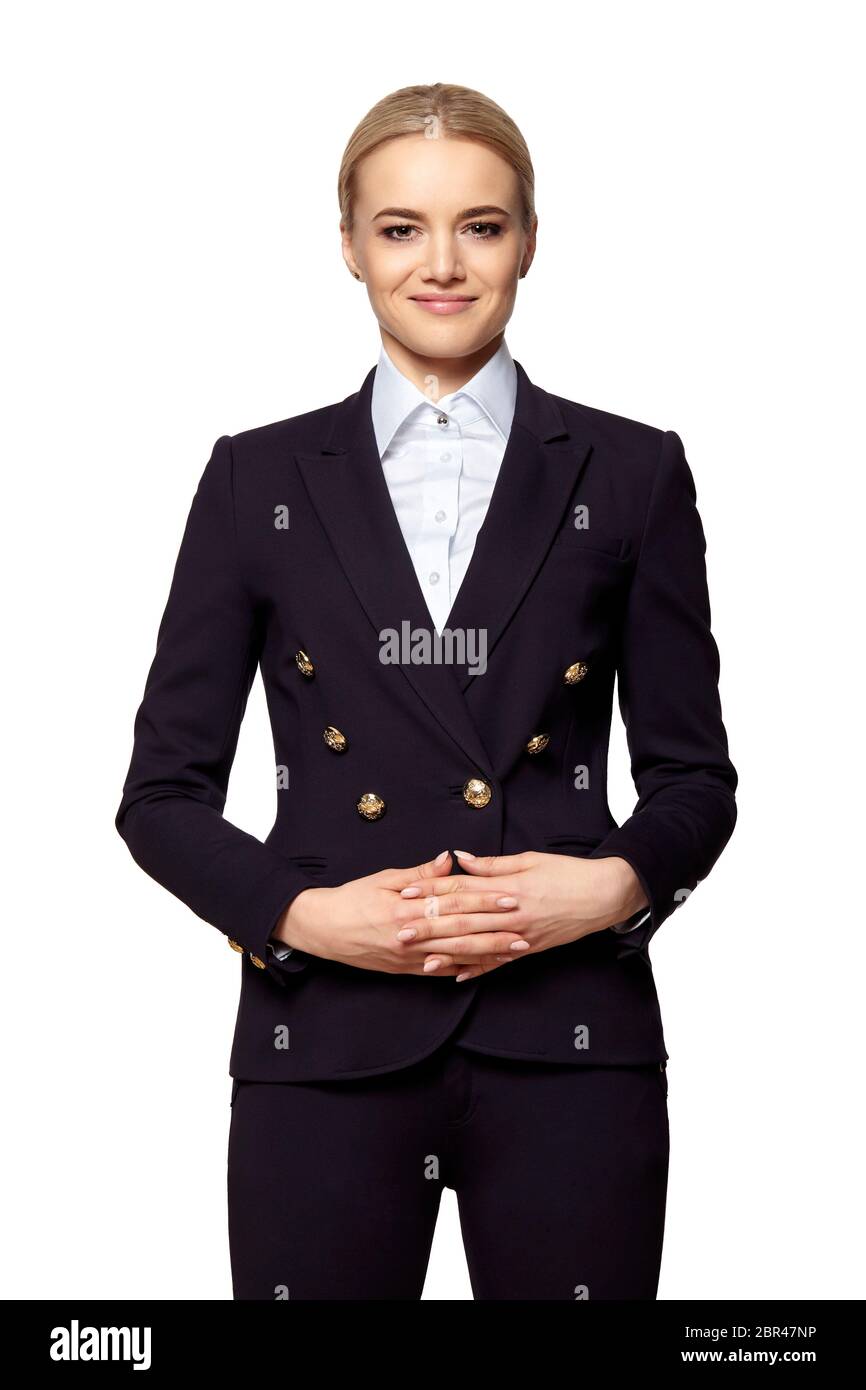 Portrait von der hübschen Blondine in Business Outfit steht mit gefalteten Händen. Stockfoto