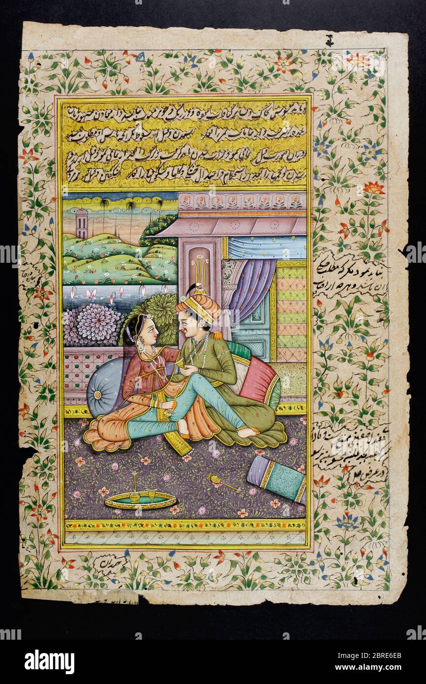 Rajasthani Miniaturmalerei aus Rajasthan, Indien. Wahrscheinlich Ende des 19. Jahrhunderts oder Anfang des 20. Jahrhunderts. Ein Mann liegt in einer Boudoir-Szene auf einer Frau. Stockfoto