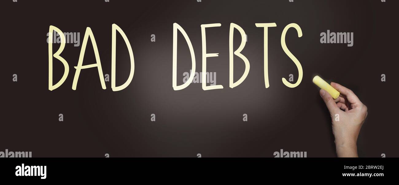 Schlechte Schulden Worte Satz mit Kreide auf Tafel. Finanzielle Verbindlichkeiten Konkurs Schuldenkrise Konzept Stockfoto
