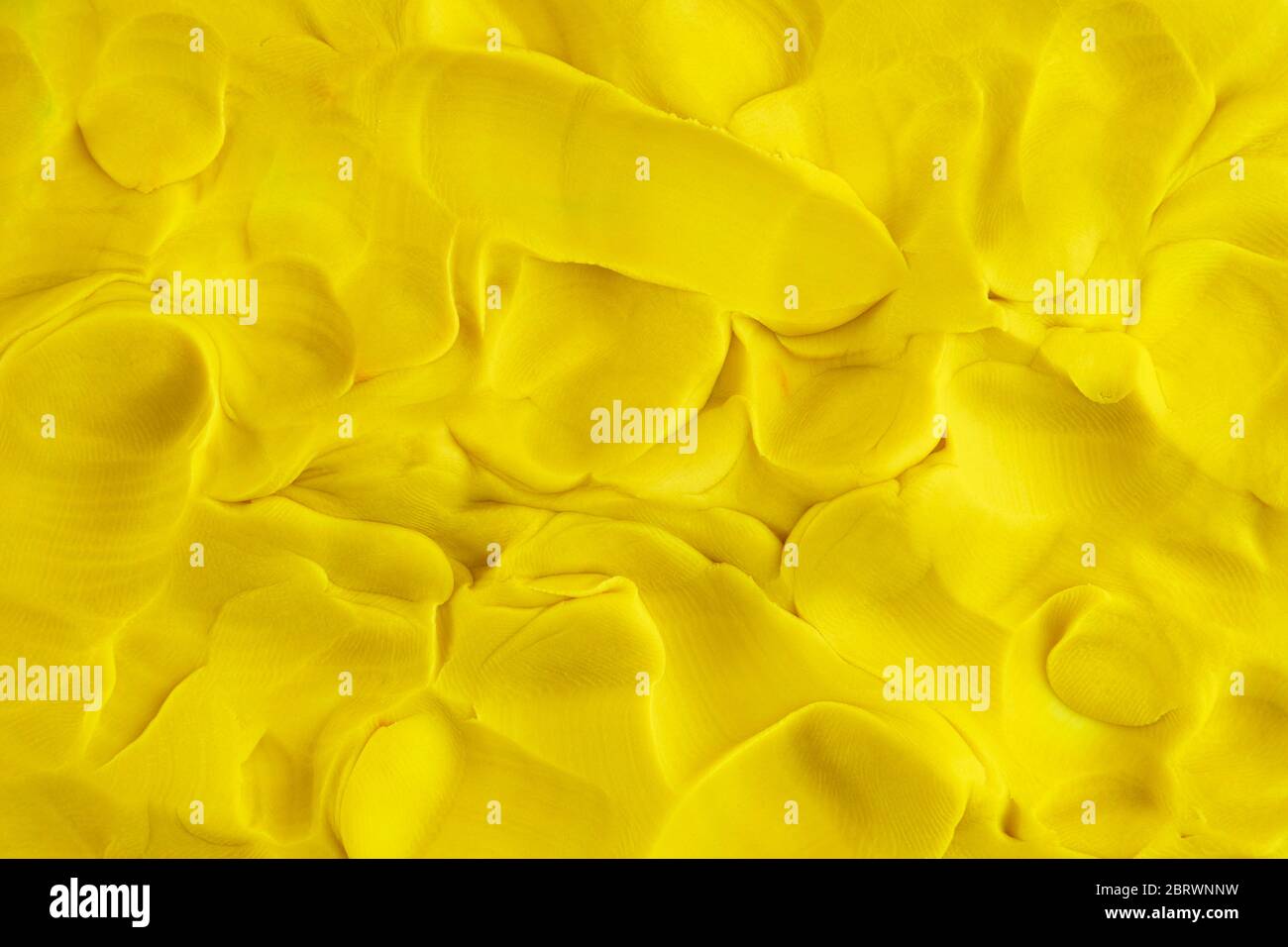 Spielen Ton gelb Hintergrund Textur. Nahaufnahme. Stockfoto