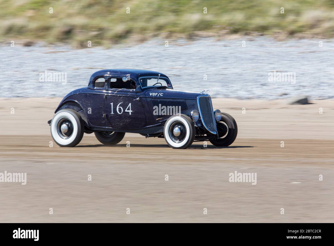 Alte amerikanische Autos Hot Rods auf Pendine Sands, Carmarthenshire, Wales UK Stockfoto