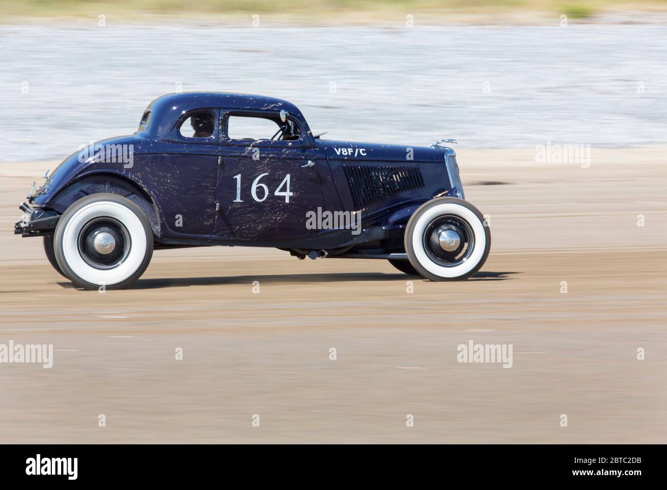 Alte amerikanische Autos Hot Rods auf Pendine Sands, Carmarthenshire, Wales UK Stockfoto