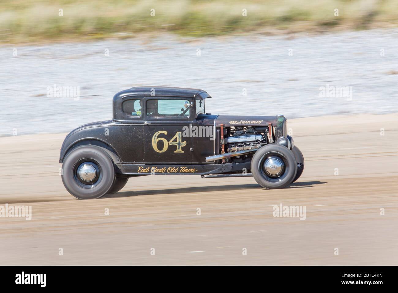 Alte amerikanische Autos Hot Rods auf Pendine Sands, Carmarthenshire, Wales UK Stockfoto