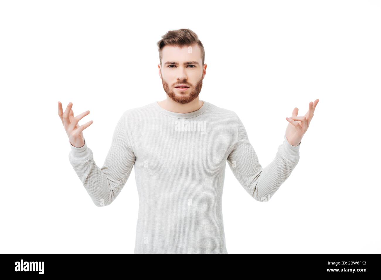 Beschämt und verwirrt junger Mann zeigt, warum Handbewegung über weißem Hintergrund Stockfoto
