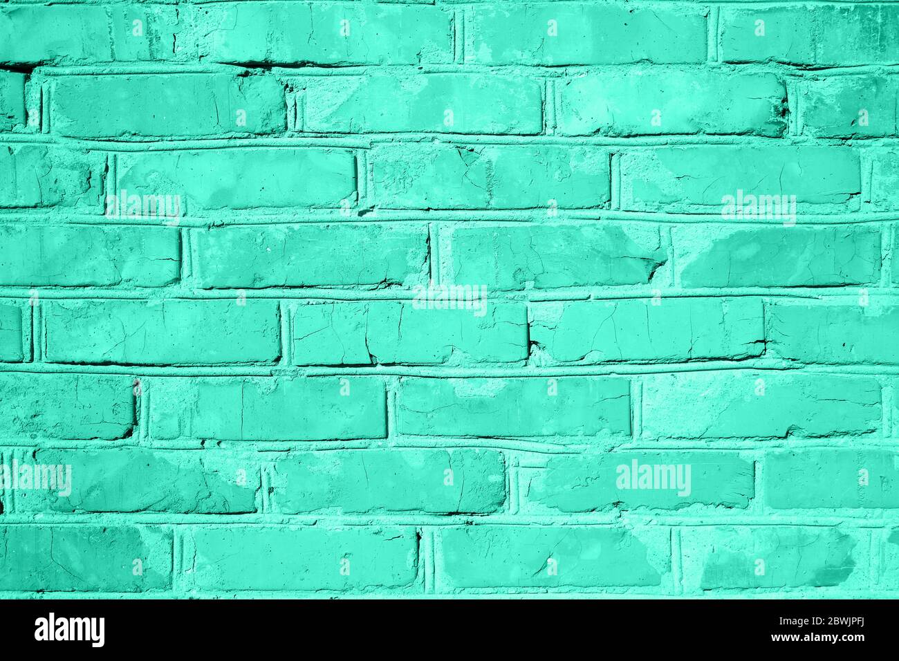 Struktur der Ziegelwand. Lebendige Biscay Grün Farbe Hintergrund mit Kopierraum für Design. Töne von biskaya-Grün. Neonmint Stockfoto