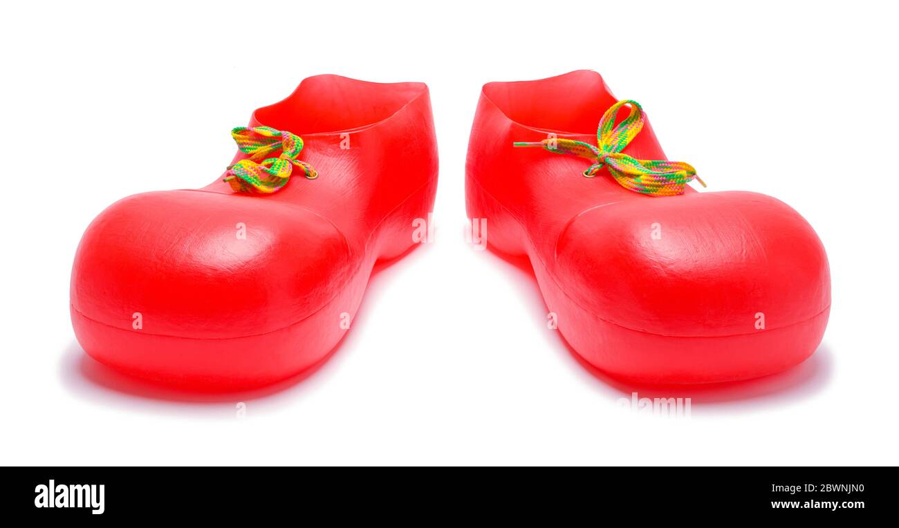 Ein Paar rote Clown Schuhe isoliert auf Weiß. Stockfoto