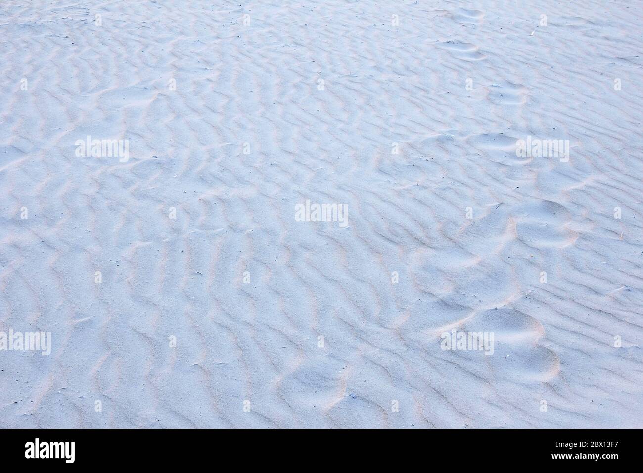 Strand Sand Textur und Muster Hintergrund blau pastellfarben Stockfoto
