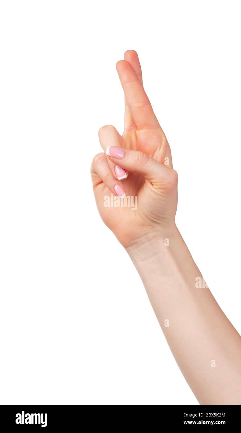 Weibliche Hand mit gekreuzten Fingern für Glück Stockfoto