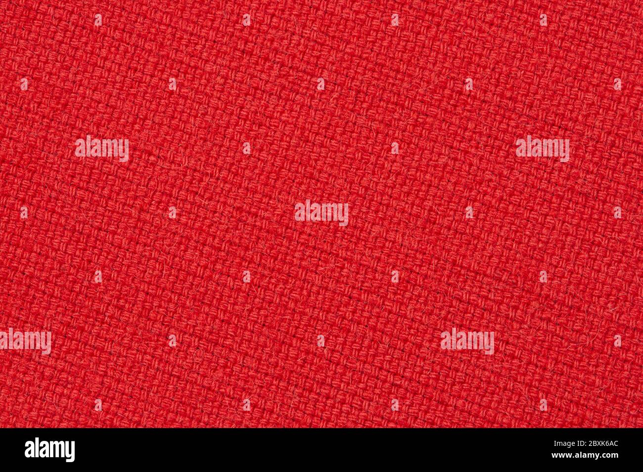 Rote Wolle Stoff Textur, diagonal angeordnete Polsterstoff Stoff Hintergrund Stockfoto