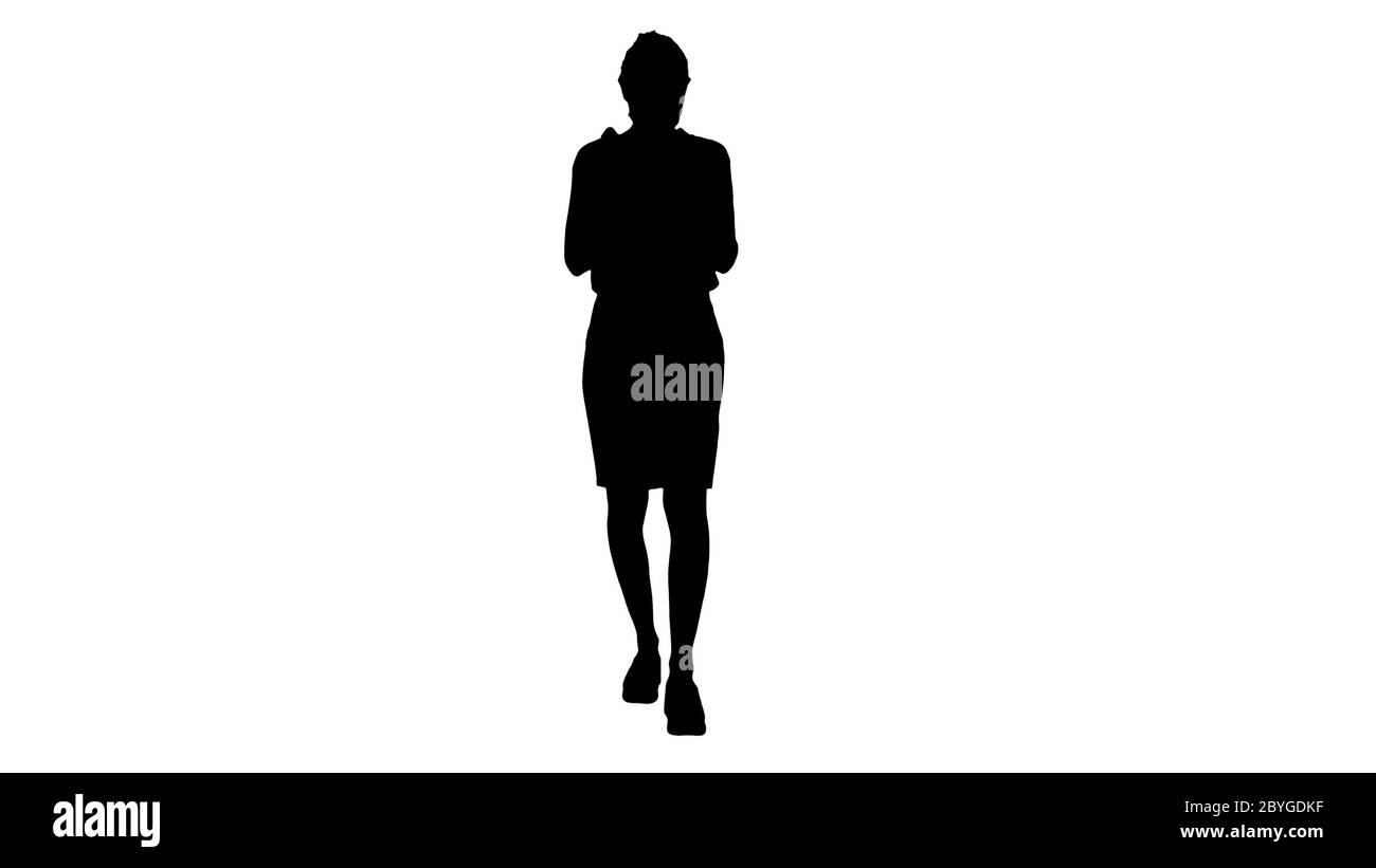 Silhouette Junge Frau verwenden die Haut Desinfektionsmittel, um ihre Hände vor Viren zu schützen. Stockfoto