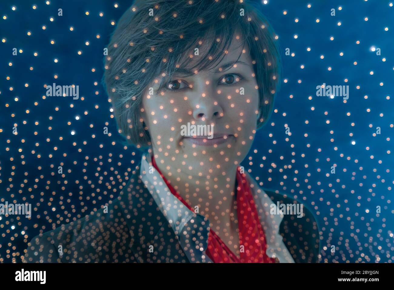 Frau und LED-Punkte in der Schweiz. Stockfoto