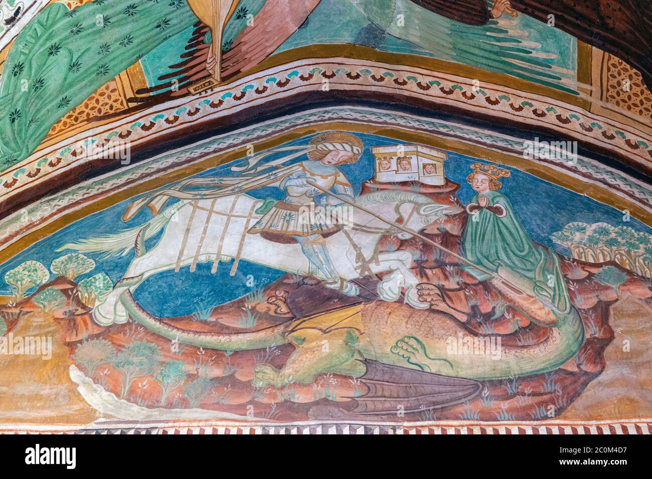 Fresko des Heiligen Georg, der den Drachen in der romanisch-gotischen Kirche des Heiligen Johannes des Täufers erschlugen hat, die um 1100 am Ufer des Bohinjer Sees gebaut wurde Stockfoto